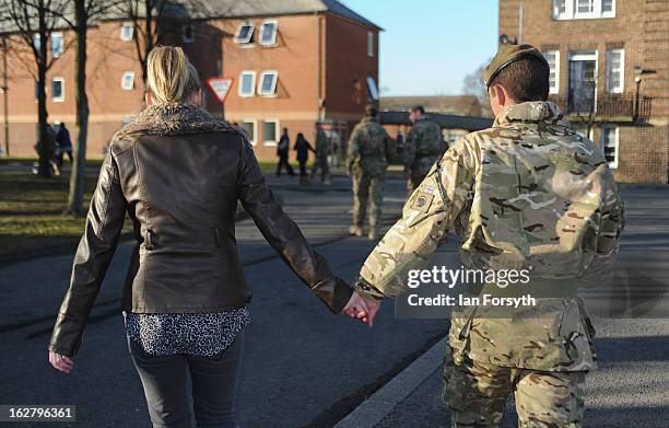 Soldiers from Headquarters Company 1st Battalion The Scots Guards return to their base at Bourlon Barracks and are reunited with their families...