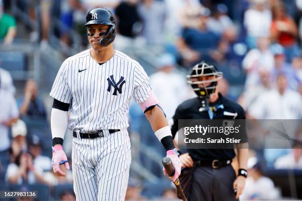 Aaron Judge of the New York Yankees reacts after being called out on strikes during the ninth inning against the Boston Red Sox at Yankee Stadium on...