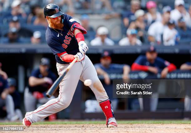 Justin Turner of the Boston Red Sox hits an RBI double during the ninth inning against the New York Yankees at Yankee Stadium on August 20, 2023 in...