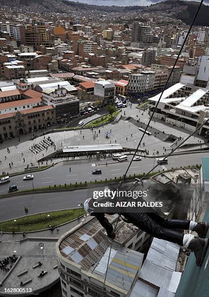 Israeli tourist Shir Cohen starts going down the wall of a hotel in La Paz on February 27, 2013. Cohen went down some 50 meters from the 17th floor...