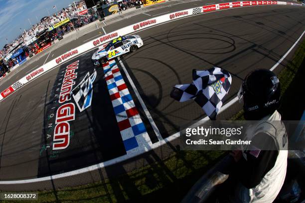 William Byron, driver of the Valvoline Chevrolet, takes the checkered flag to win the NASCAR Cup Series Go Bowling at The Glen at Watkins Glen...