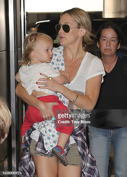 Kate Hudson and her son Bingham Hawn Bellamy are sighted at Miami International Airport on February 27, 2013 in Miami, Florida.
