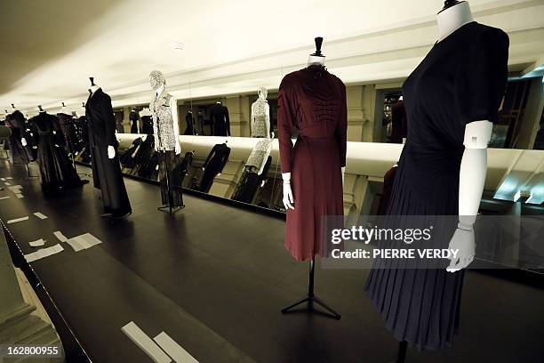 Dresses by French fashion houses Martial & Armand and Jean Desses are displayed at the Haute Couture exhibition in the storage of the Galliera...