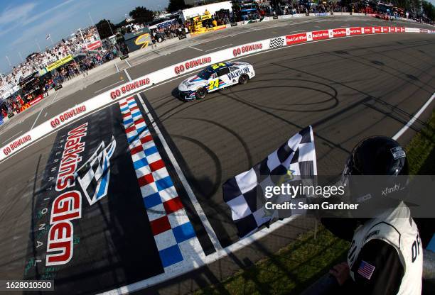 William Byron, driver of the Valvoline Chevrolet, takes the checkered flag to win the NASCAR Cup Series Go Bowling at The Glen at Watkins Glen...