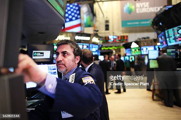 Traders work on the floor of the New York Stock Exchange on February 27, 2013 in New York City. Following more positive housing data and encouraging...
