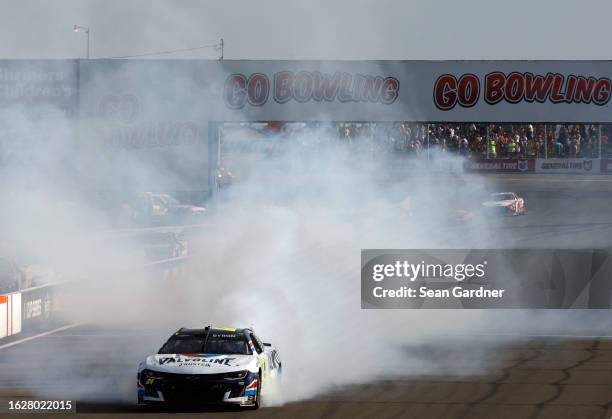 William Byron, driver of the Valvoline Chevrolet, celebrates with a burnout after winning the NASCAR Cup Series Go Bowling at The Glen at Watkins...