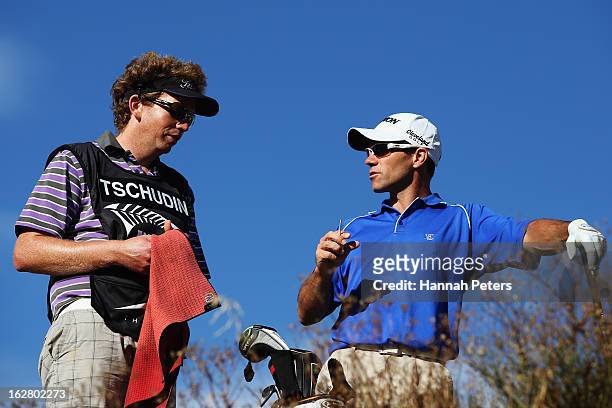 Andrew Tschudin of Australia talks to his caddy during day one of the NZ PGA Championship at The Hills Golf Club on February 28, 2013 in Queenstown,...