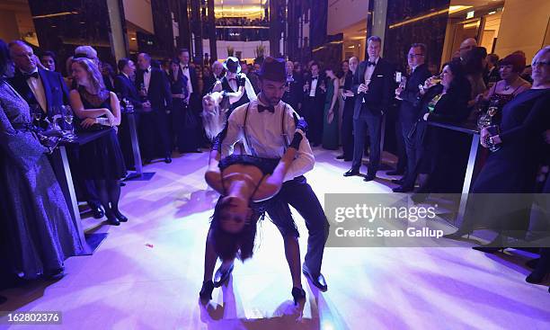 Dancers perform at the grand opening of the Waldorf Astoria Berlin hotel on February 27, 2013 in Berlin, Germany.