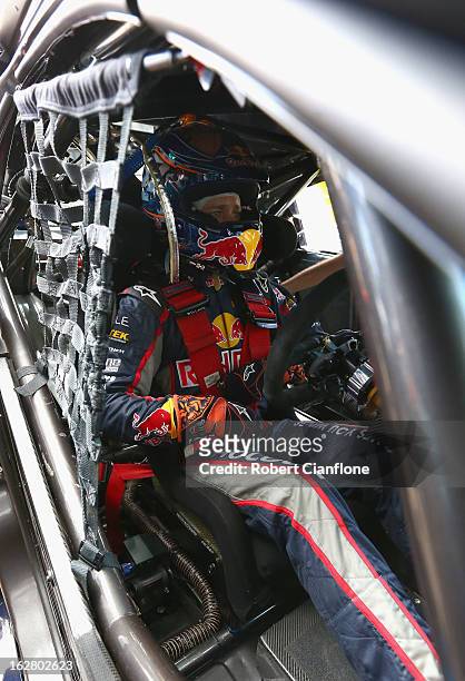Casey Stoner driver of the Red Bull Pirtek Holden sits in his car prior to practice for round one of the V8 Supercars Dunlop Development Series at...