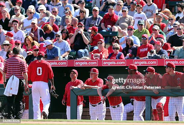 Infielder Bill Hall of the Los Angeles Angels leaves the field with an injury during the spring training game against the San Francisco Giants at...