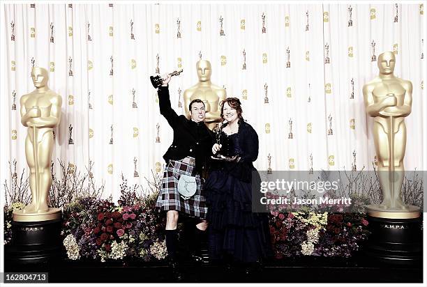 Directors Mark Andrews and Brenda Chapman, winners of the Best Animated Feature award for 'Brave,' pose in the press room during the Oscars held at...