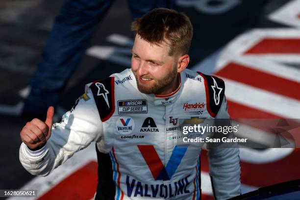 William Byron, driver of the Valvoline Chevrolet, gives a thumbs up to fans after winning the NASCAR Cup Series Go Bowling at The Glen at Watkins...