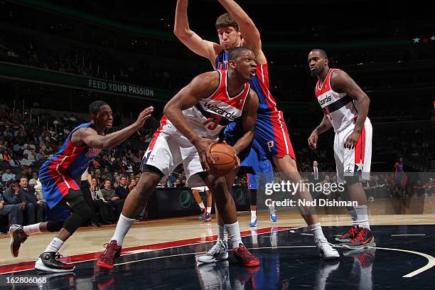 Kevin Seraphin of the Washington Wizards rebounds against Viacheslav Kravtsov of the Detroit Pistons during the game at the Verizon Center on...
