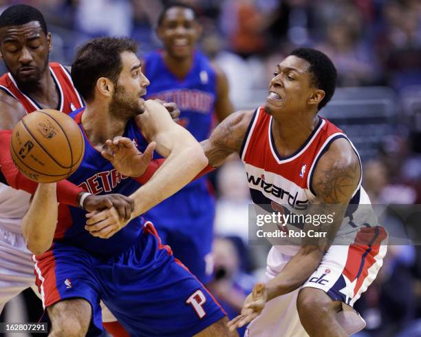 Bradley Beal of the Washington Wizards fouls Jose Calderon of the Detroit Pistons during the second half as John Wall of the Washington Wizards looks...