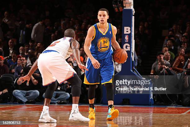Stephen Curry of the Golden State Warriors advances the ball against Raymond Felton of the New York Knicks on February 27, 2013 at Madison Square...