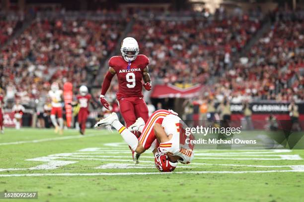 Justin Watson of the Kansas City Chiefs completes a pass for a touchdown against Isaiah Simmons of the Arizona Cardinals during an NFL preseason...