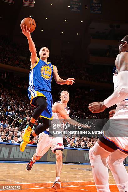 Stephen Curry of the Golden State Warriors shoots a layup ahead of Pablo Prigioni of the New York Knicks on February 27, 2013 at Madison Square...