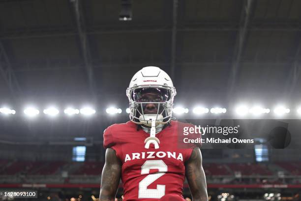 Marquise Brown of the Arizona Cardinals looks on as he stretches prior to an NFL preseason football game between the Arizona Cardinals and the Kansas...