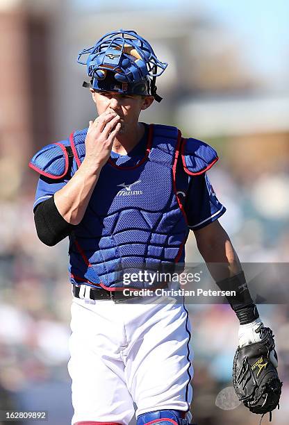 Catcher Eli Whiteside of the Texas Rangers in action during the spring training game against the Kansas City Royals at Surprise Stadium on February...