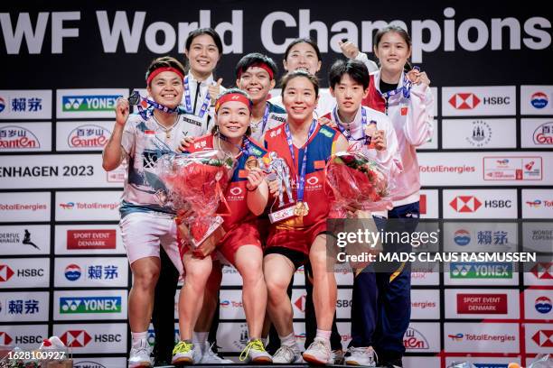 Gold medalists China's Chen Qing Chen and Jia Yi Fan , silver medalists Indonesia's Apriyani Rahayu and Siti Fadia Silva Ramadhanti , bronze...