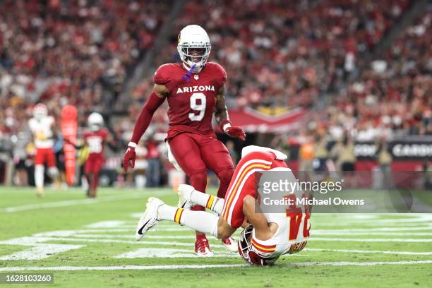 Justin Watson of the Kansas City Chiefs completes a pass for a touchdown against Isaiah Simmons of the Arizona Cardinals during an NFL preseason...