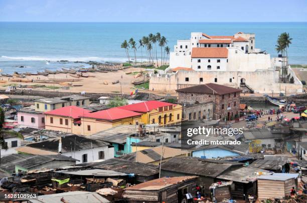 view over elmina town, elmina castle ('são jorge da mina') and elmina beach, gulf of guinea, ghana - accra stock pictures, royalty-free photos & images