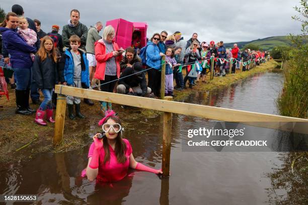 Competitor takes part in the World Bog Snorkelling Championships held at the Waen Rhydd peat bog, Llanwrtyd Wells, Mid Wales, on August 27, 2023. The...