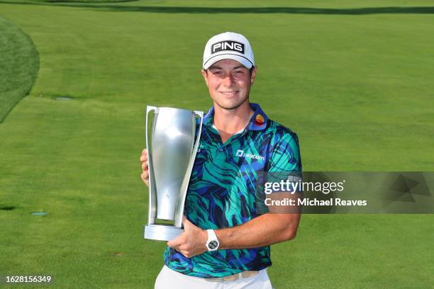 Viktor Hovland of Norway poses with the J.K. Wadley Trophy after winning the BMW Championship at Olympia Fields Country Club on August 20, 2023 in...