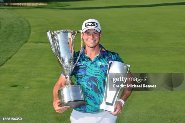 Viktor Hovland of Norway poses with the J.K. Wadley Trophy after winning the BMW Championship at Olympia Fields Country Club on August 20, 2023 in...