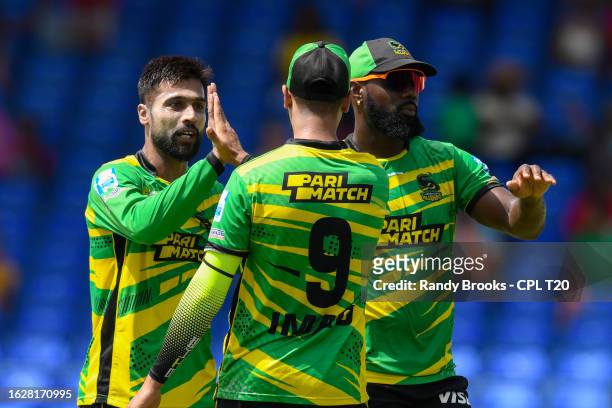 Mohammad Amir and Raymon Reifer of Jamaica Tallawahs celebrate the dismissal of Azam Khan of Guyana Amazon Warriors during the Men's 2023 Republic...