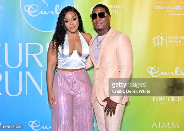 Kendra Robinson and Yung Joc attend the CURLS On The Runway 2023 Celebrity Charity Fashion Show at The Carlyle on August 20, 2023 in Atlanta, Georgia.