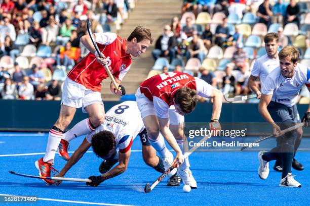 Simon Martin-Brisac of France and Nico Wellan of Austria battle for the ball during the 2023 Men's EuroHockey Championship match between Austria vs...