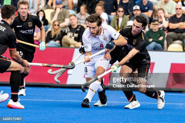 Teo Hinrichs of Germany and Cedric Charlier of Belgium battle for the ball during the 2023 Men's EuroHockey Championship - 3rd place match between...