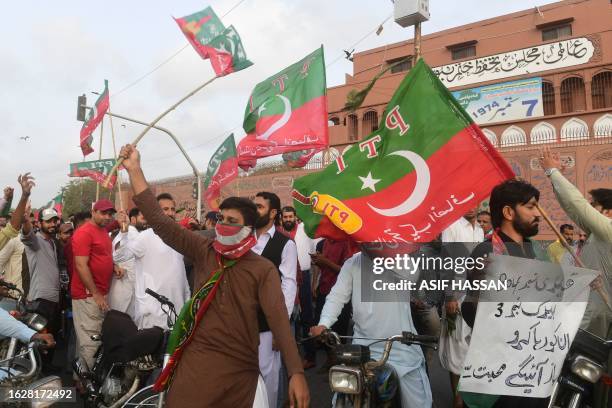 Pakistan Tehreek-e-Insaf party activists and supporters protest against the arrest of Pakistan's former Prime Minister Imran Khan, in Karachi on...