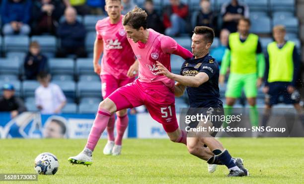 Hearts' Alex Lowry and Dundee's Cammy Kerr in action during a cinch Premiership match between Dundee and Heart of Midlothian at the Kilmac Stadium at...