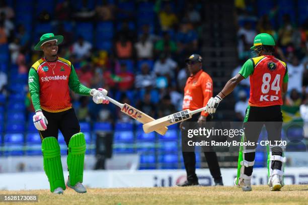 Shimron Hetmyer and Keemo Paul of Guyana Amazon Warriors knock bats during the Men's 2023 Republic Bank Caribbean Premier League match 11 between...