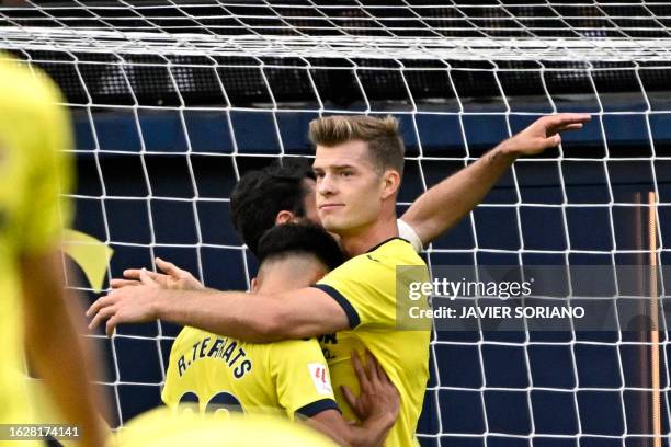 Villarreal's Norwegian forward Alexander Sorloth celebrates with Villarreal's Spanish defender Ramon Terrats scoring his team's second goal during...