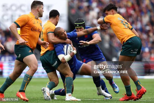 France's inside centre Gael Fickou is tackled by Australia's centre Lalakai Foketi during the pre-World Cup rugby union international Test match...