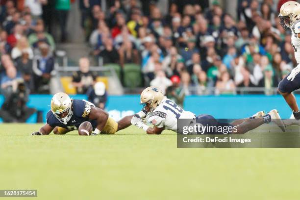 Audric Estimé of Notre Dame fumbles the ball during the Aer Lingus College Football Classic match between Notre Dame and Navy Midshipmen at Aviva...