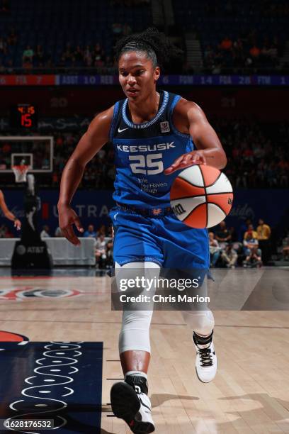 Alyssa Thomas of the Connecticut Sun dribbles the ball during the game against the Los Angeles Sparks on August 27, 2023 at the Mohegan Sun Arena in...