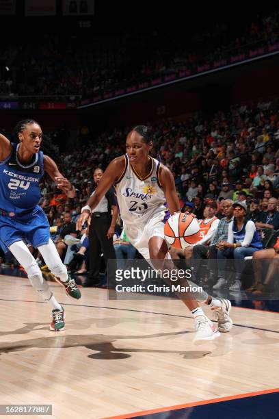 Azura Stevens of the Los Angeles Sparks dribbles the ball during the game against the Connecticut Sun on August 27, 2023 at the Mohegan Sun Arena in...