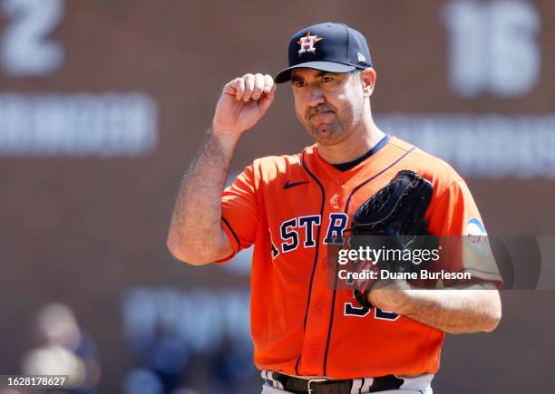 Pitcher Justin Verlander of the Houston Astros acknowledges Miguel Cabrera of the Detroit Tigers during his at-bat in the second inning at Comerica...