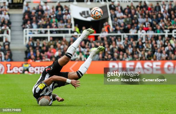 Newcastle United's Joelinton falls over during the Premier League match between Newcastle United and Liverpool FC at St. James Park on August 27,...