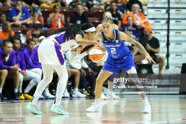 Connecticut Sun guard Natisha Hiedeman defends Los Angeles Sparks guard Jordin Canada during a WNBA game between Los Angeles Sparks and Connecticut...