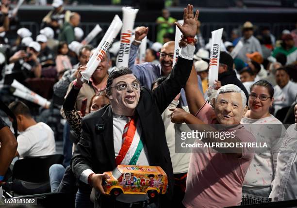 Supporters wear masks depicting former Mexican Foreign Minister and presidential pre-candidate for the Morena party, Marcelo Ebrard , and Mexican...