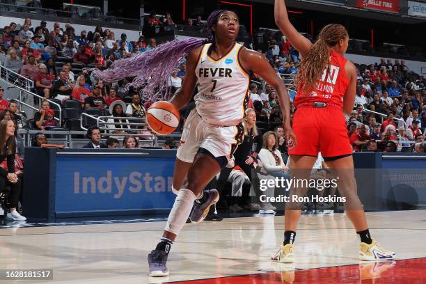 Aliyah Boston of the Indiana Fever drives to the basket during the game against the Atlanta Dream on August 27, 2023 at Gainbridge Fieldhouse in...