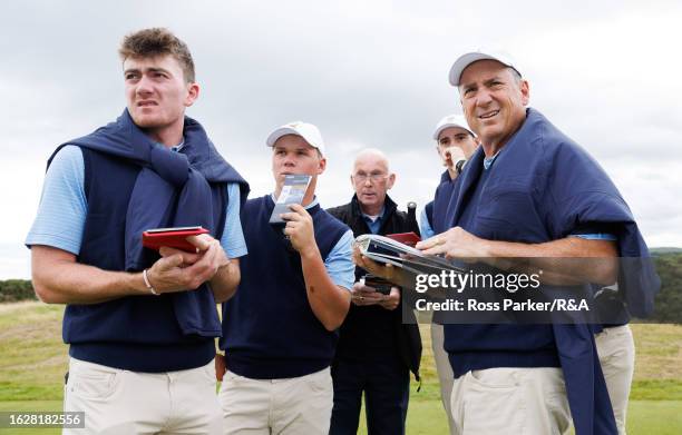 Team USA Members Nick Dunlap, Caleb Surratt, Nick Gabrelcik and coach Mike McCoy speak with local caddie Steve Jones during a course walk through...