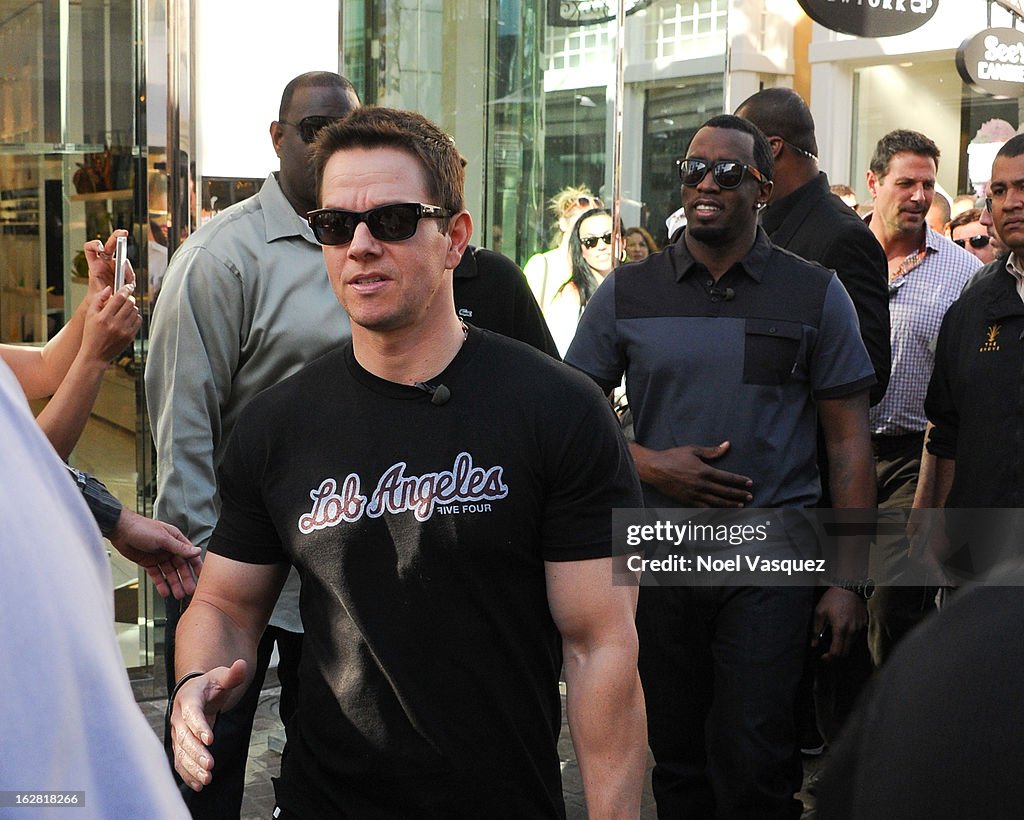 Jimmie Johnson, Mark Wahlberg, And Sean Combs On "Extra"