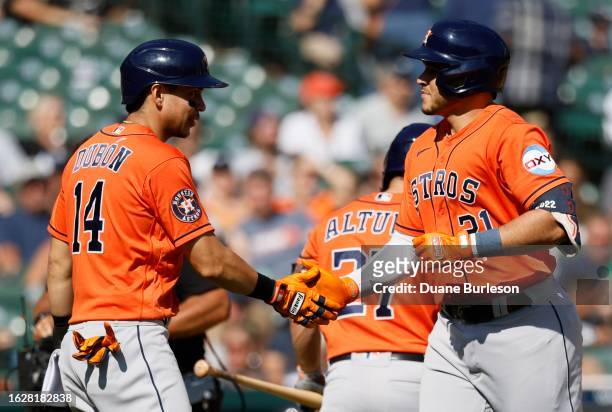 Yainer Diaz of the Houston Astros celebrates with Mauricio Dubon after hitting a two-run home run against the Detroit Tigers during the eighth inning...