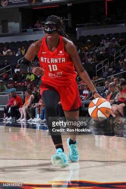 Rhyne Howard of the Atlanta Dream dribbles the ball during the game against the Indiana Fever on August 27, 2023 at Gainbridge Fieldhouse in...